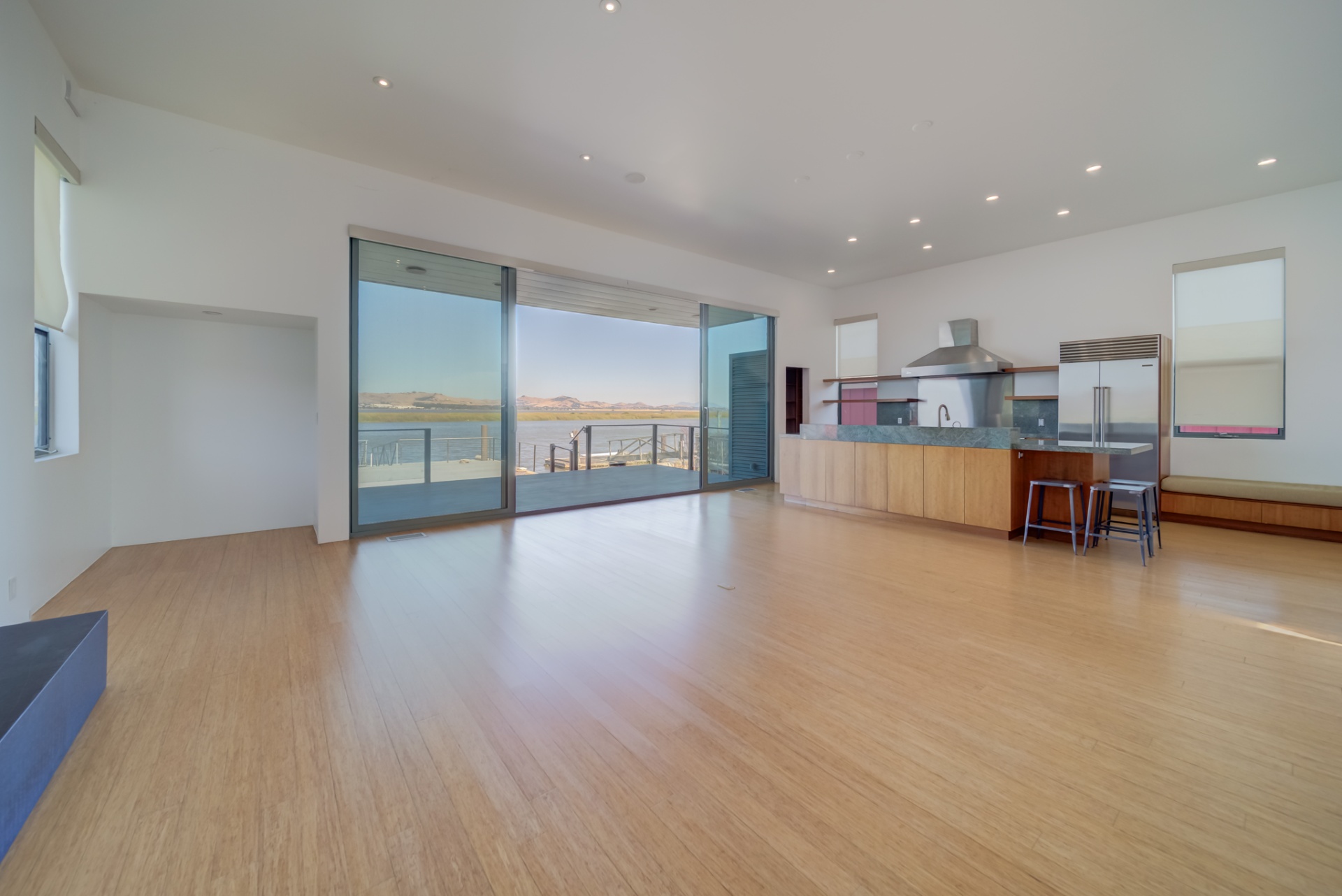 Great room opening to the waterfront terrace